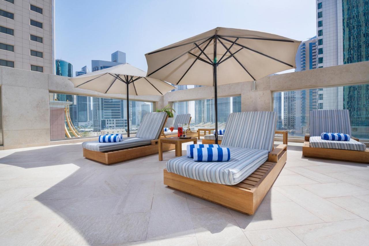 Wyndham Grand Doha West Bay Beach Экстерьер фото The pool deck at the hotel